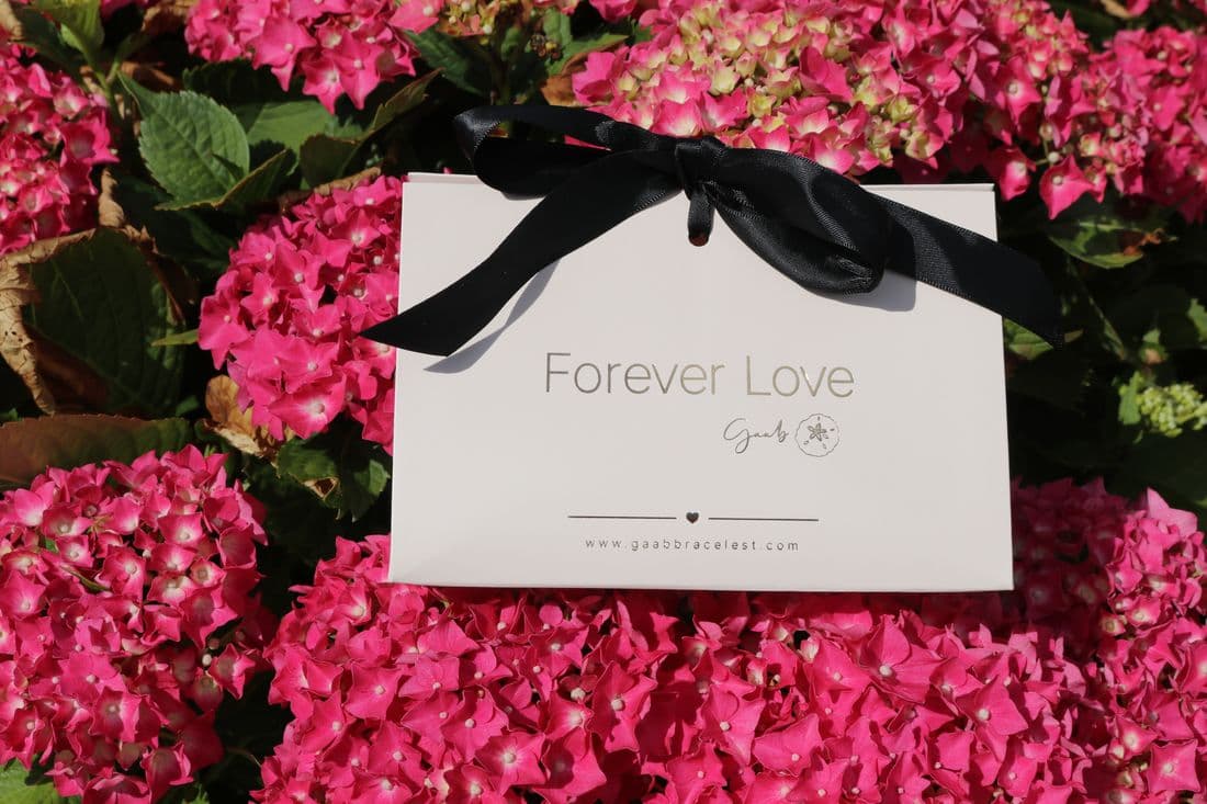 Forever Love gift box among pink hydrangeas